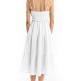 Tiered midi dress with a deep v-neck, adjustable spaghetti straps, ruffled under bodice and smocked back in ivory