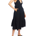 Tiered midi dress with a deep v-neck, spaghetti straps, ruffled under bodice and smocked back in black