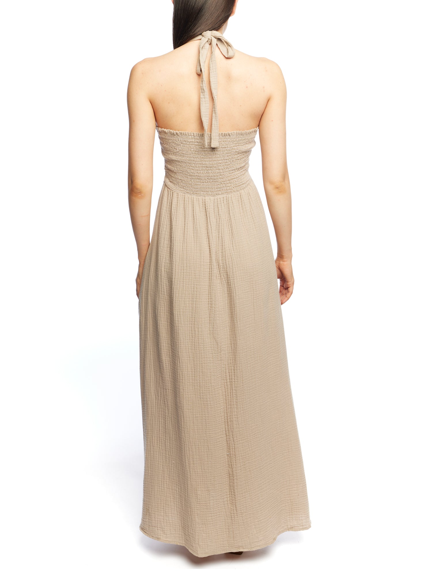 Maxi halter dress with cinched front, tie neck, under bust/side cutouts, smocked back and pockets in mocha