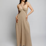 Maxi halter dress with cinched front, tie neck, under bust/side cutouts, smocked back and pockets in mocha