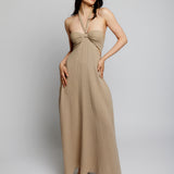 Maxi halter dress with cinched front, tie neck, under bust/side cutouts, smocked back and pockets in mocha