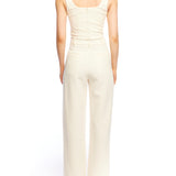 Mid-rise, wide leg pants with pleated front, side pockets, faux back pockets and belt loops in ivory