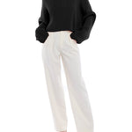 Mid-rise, wide leg pants with pleated front, side pockets, faux back pockets and belt loops in ivory