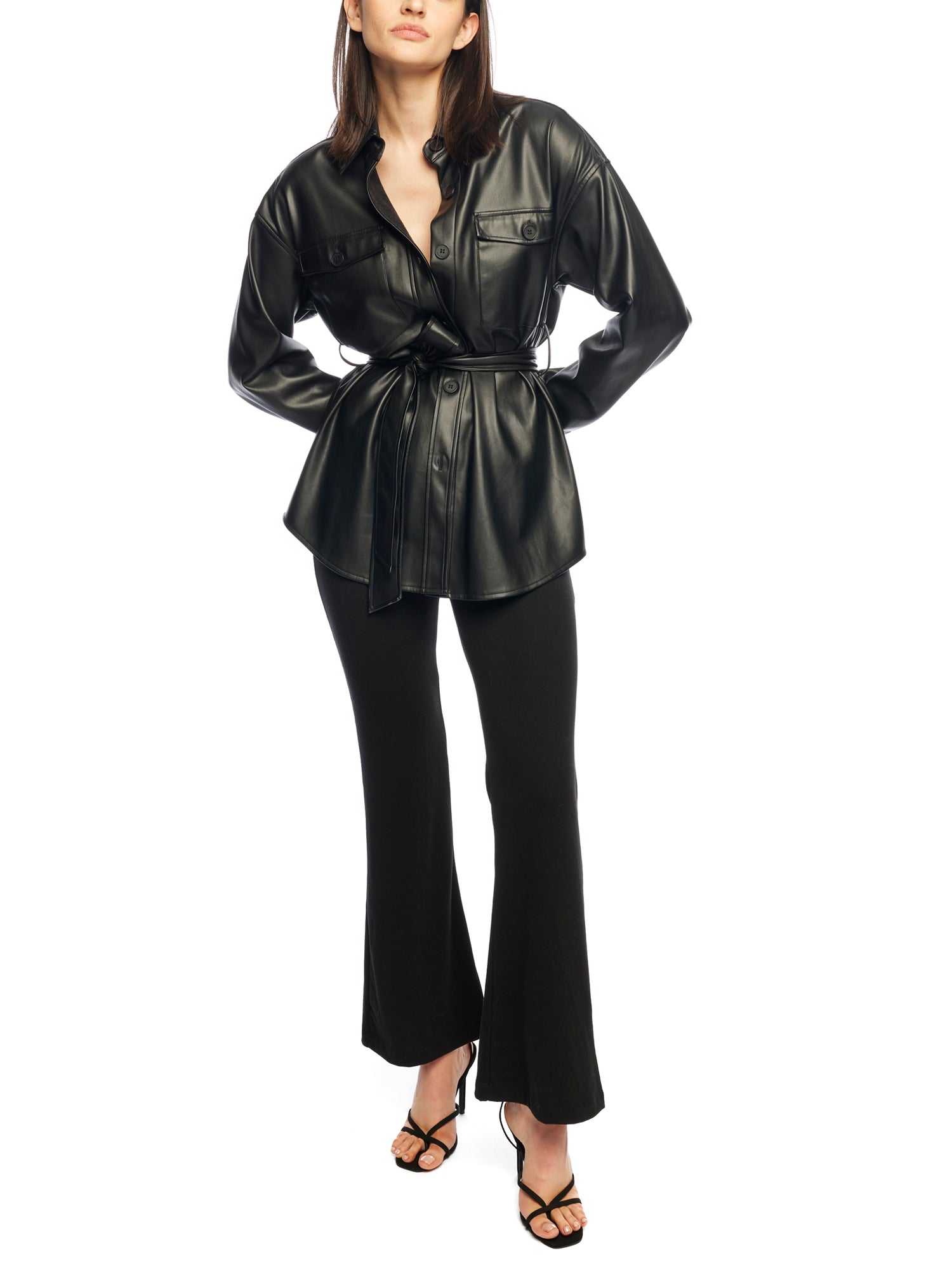  faux leather, button down top with side pockets, breast pockets, removable belt and long, cuffed sleeves in black