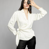 collared, side tie blouse featuring long sleeves with button cuffs in ivory