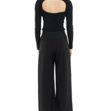 mid-rise, wide leg trousers with a zipper and button closure, side and back pockets - back view