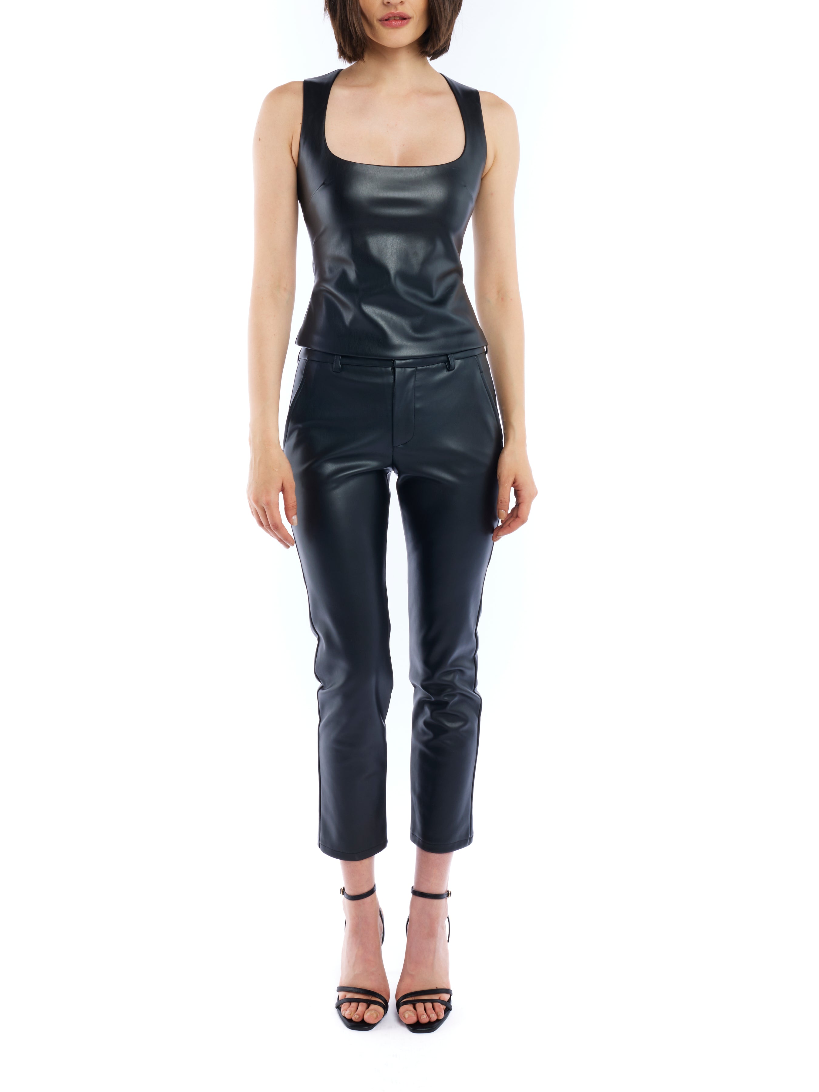 faux leather trouser with a medium rise, belt loops, slightly cropped cut and side pockets in black