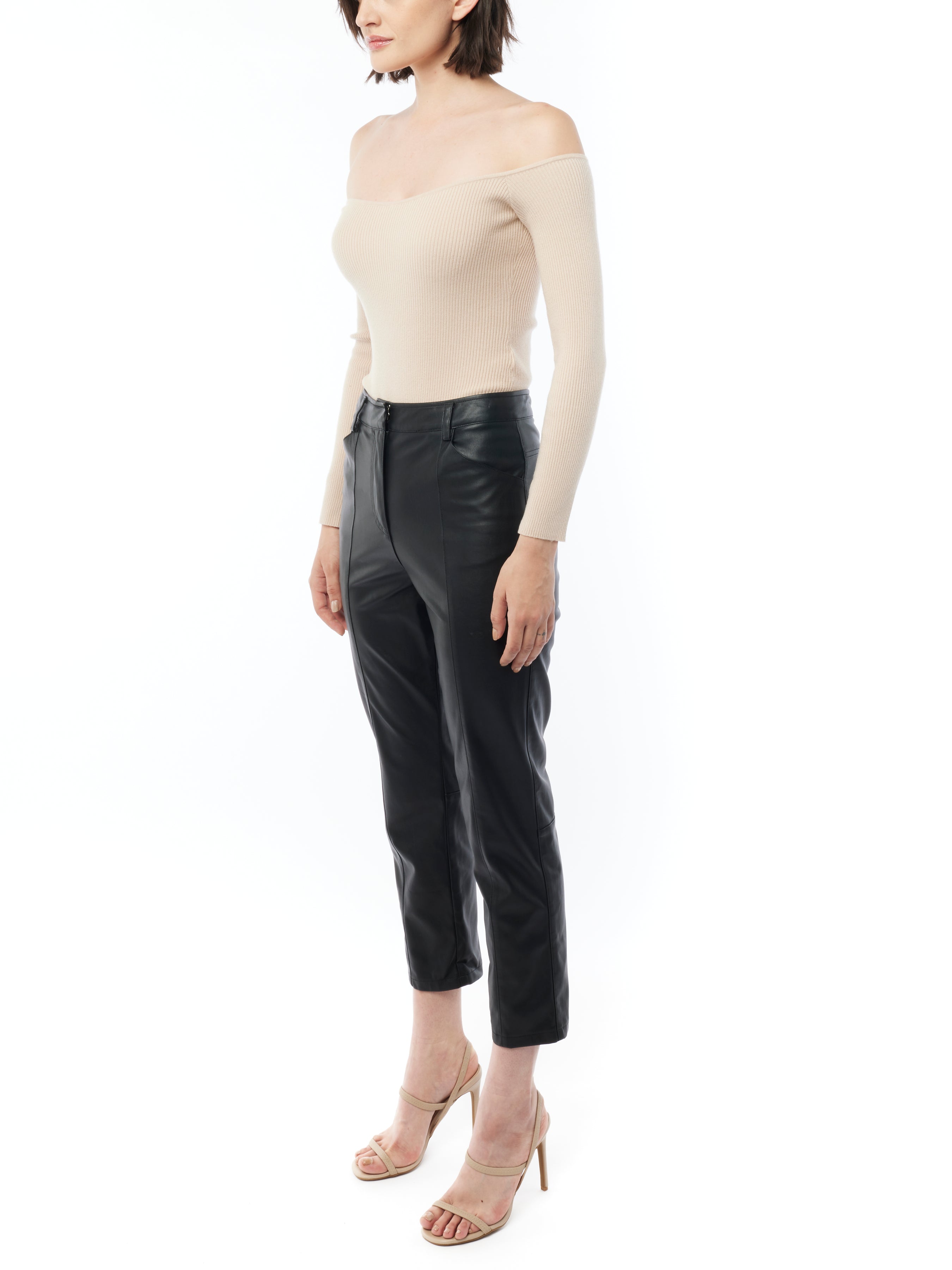faux leather pants with a mid rise, cropped length and pockets in black