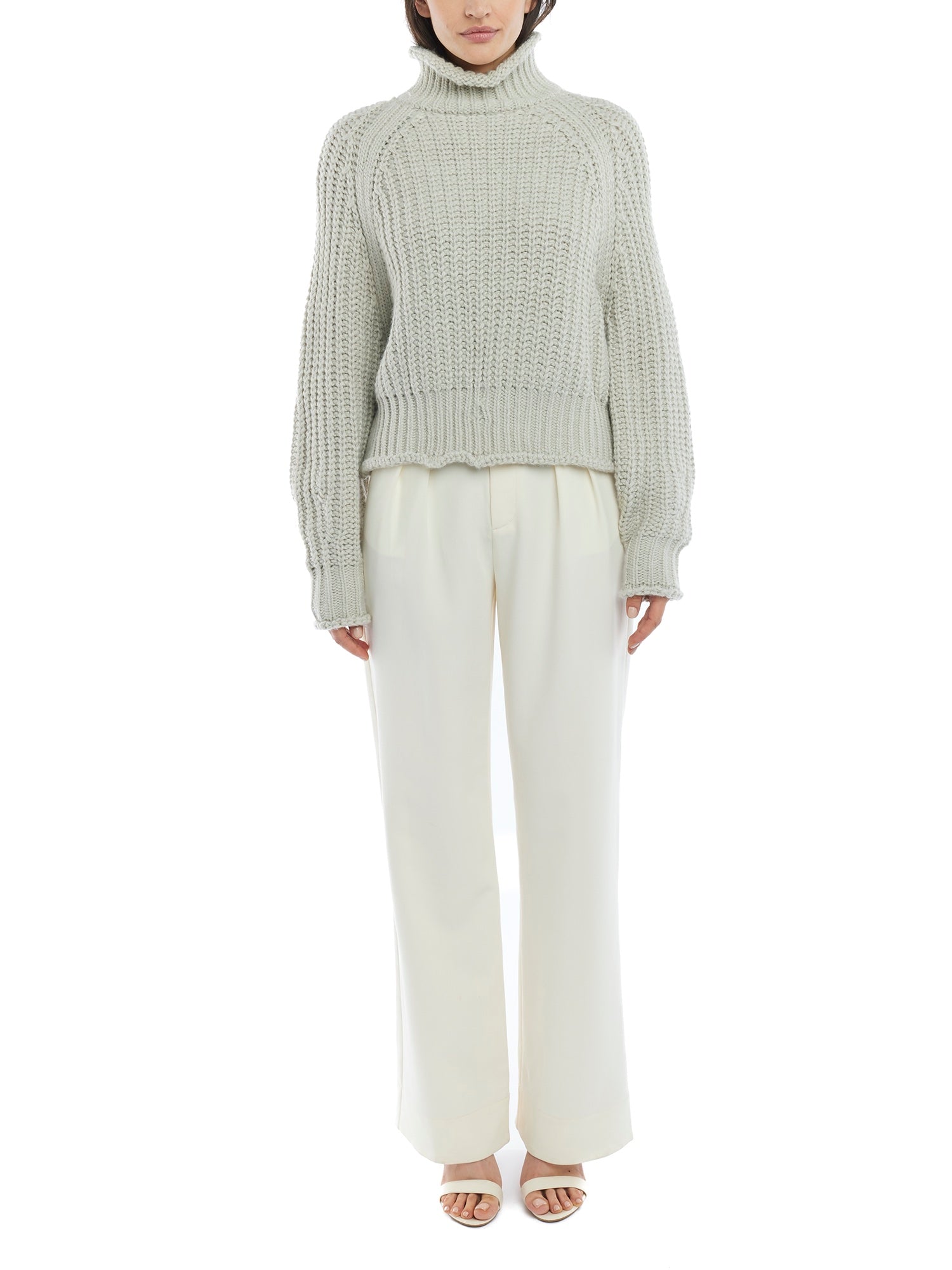 ribbed, chunky knit turtleneck sweater featuring slight balloon sleeves and a funnel neck in grey