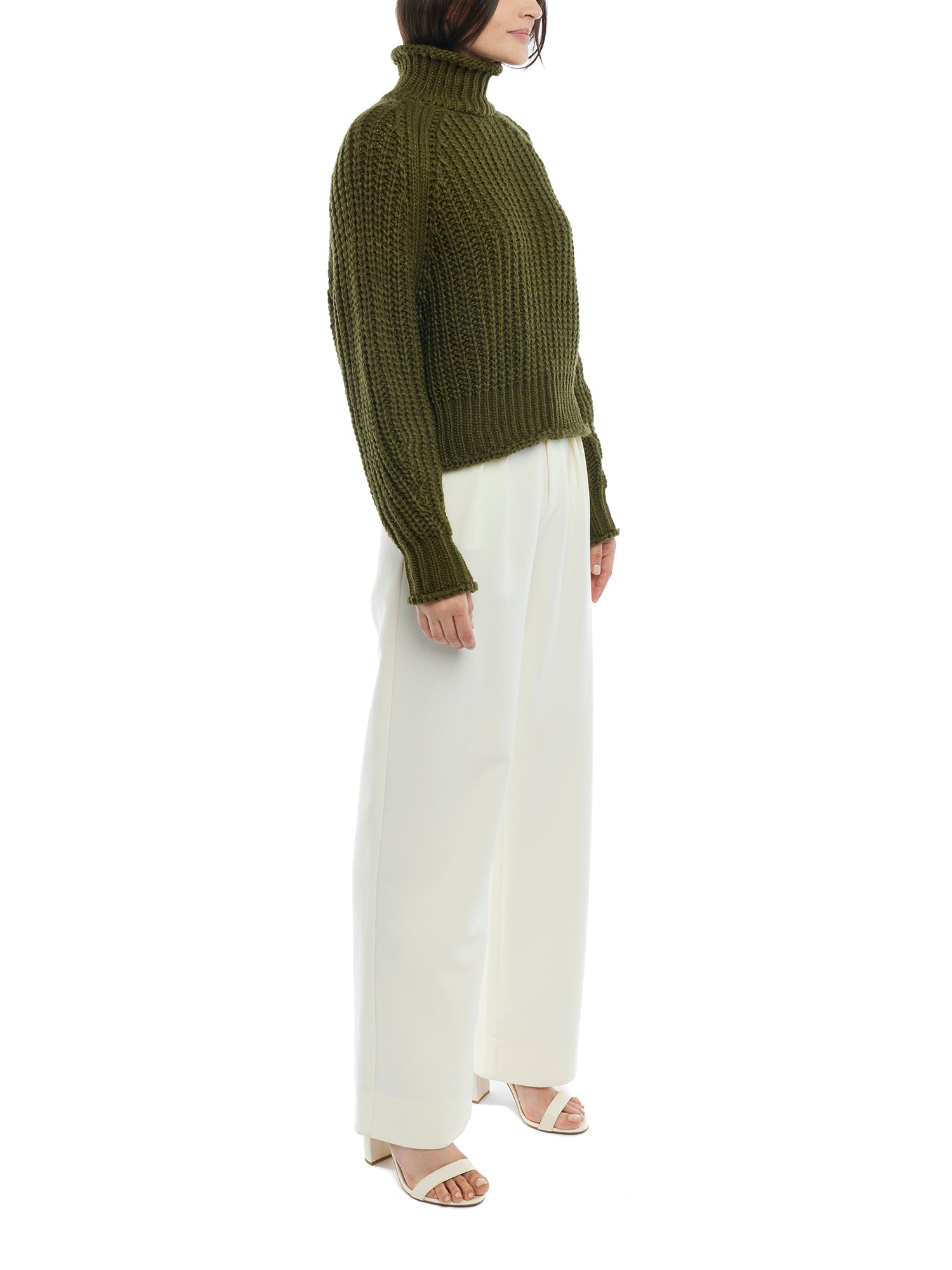 ribbed, chunky knit turtleneck sweater featuring slight balloon sleeves and a funnel neck in olive
