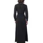 Long collared black dress with button down front, long cuffed sleeves and pockets. back view