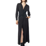 Long collared black dress with button down front, long cuffed sleeves and pockets. Front view