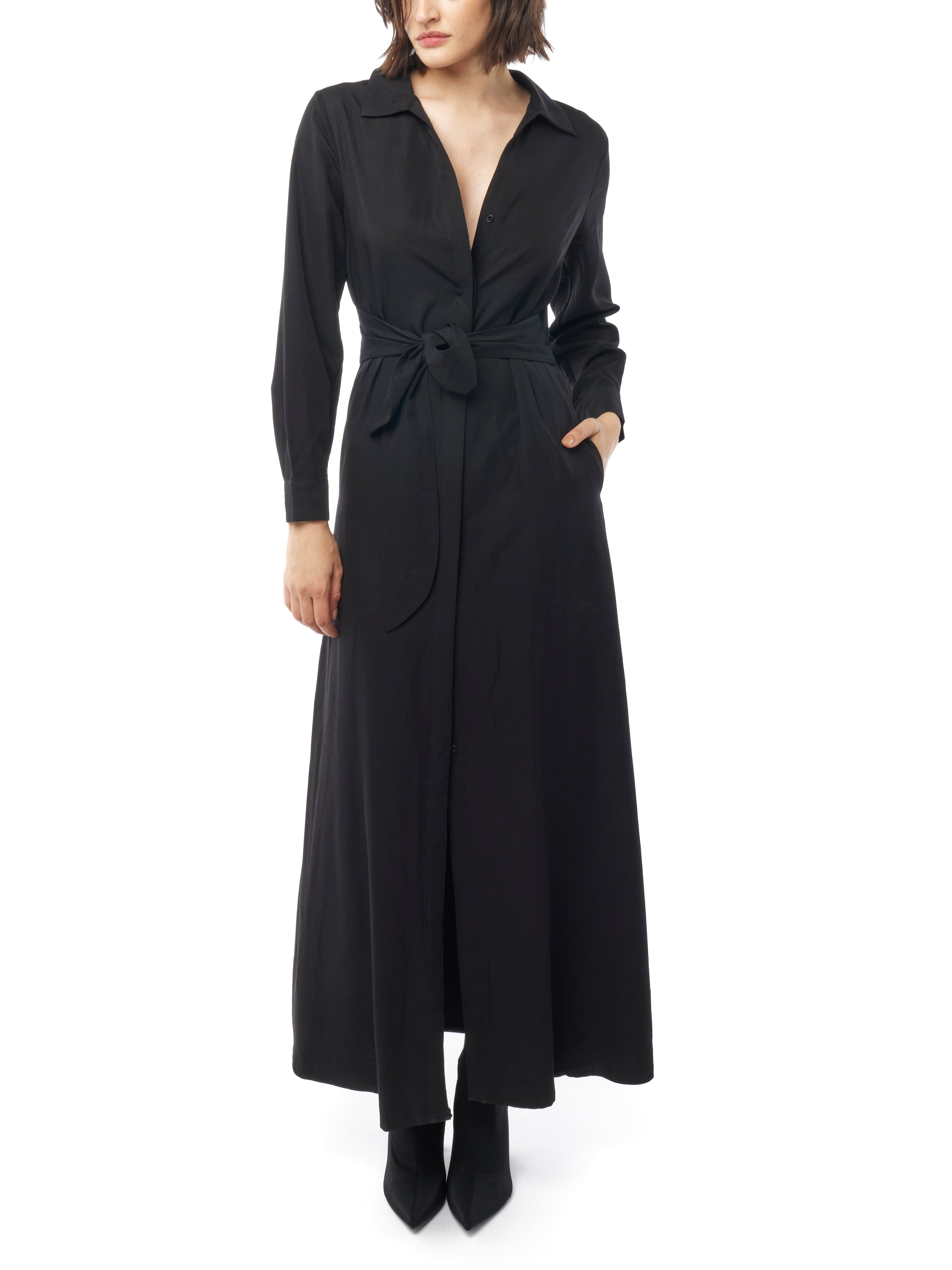 Long collared black dress with button down front, long cuffed sleeves and pockets. Front view 2