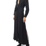 Long collared black dress with button down front, long cuffed sleeves and pockets. Side view
