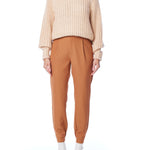 ribbed, chunky knit turtleneck sweater featuring slight balloon sleeves and a funnel neck in blush