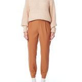 ribbed, chunky knit turtleneck sweater featuring slight balloon sleeves and a funnel neck in blush