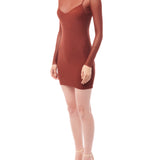 figure hugging, long sleeve mini dress with a sheer mock neck, sheer long sleeves with a spaghetti strap slip lining in rust