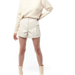 Faux leather, high-waisted short with a gathered elasticized back, pleated front and pockets in ivory