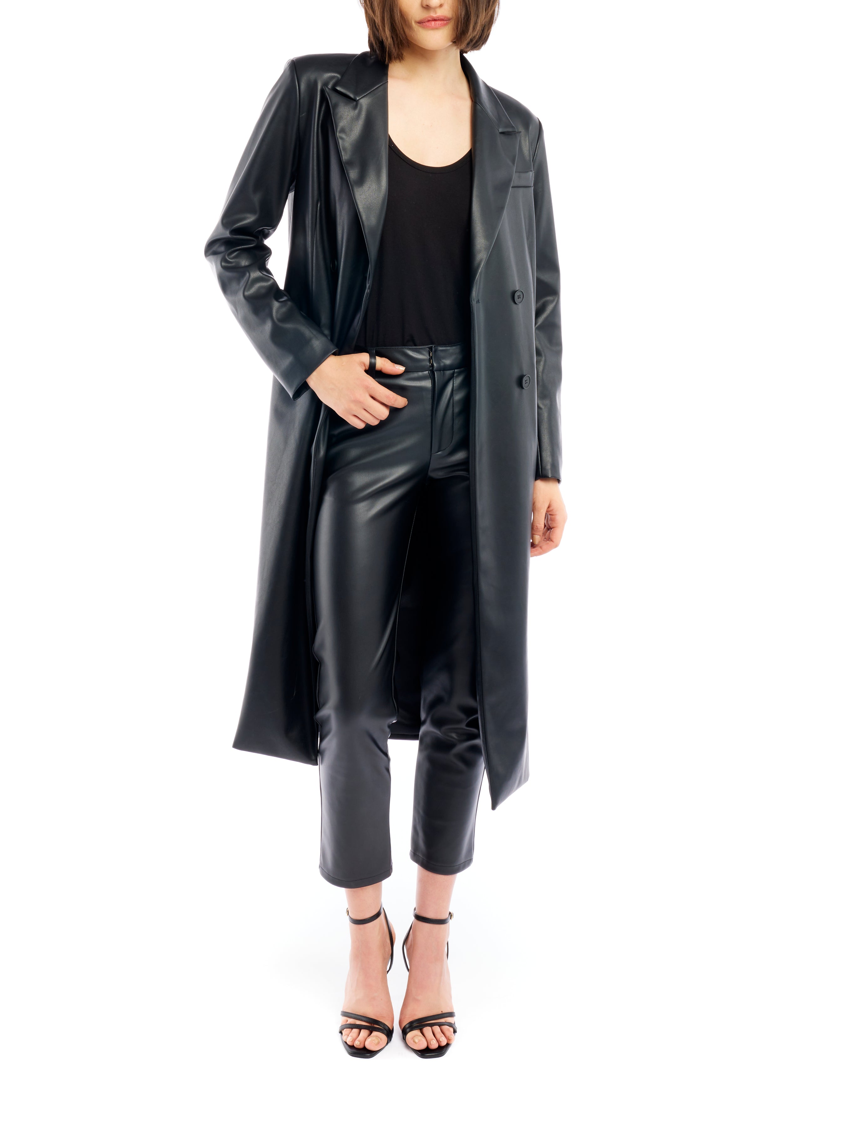 Midi length, double breasted, vegan leather jacket featuring long sleeves and pockets