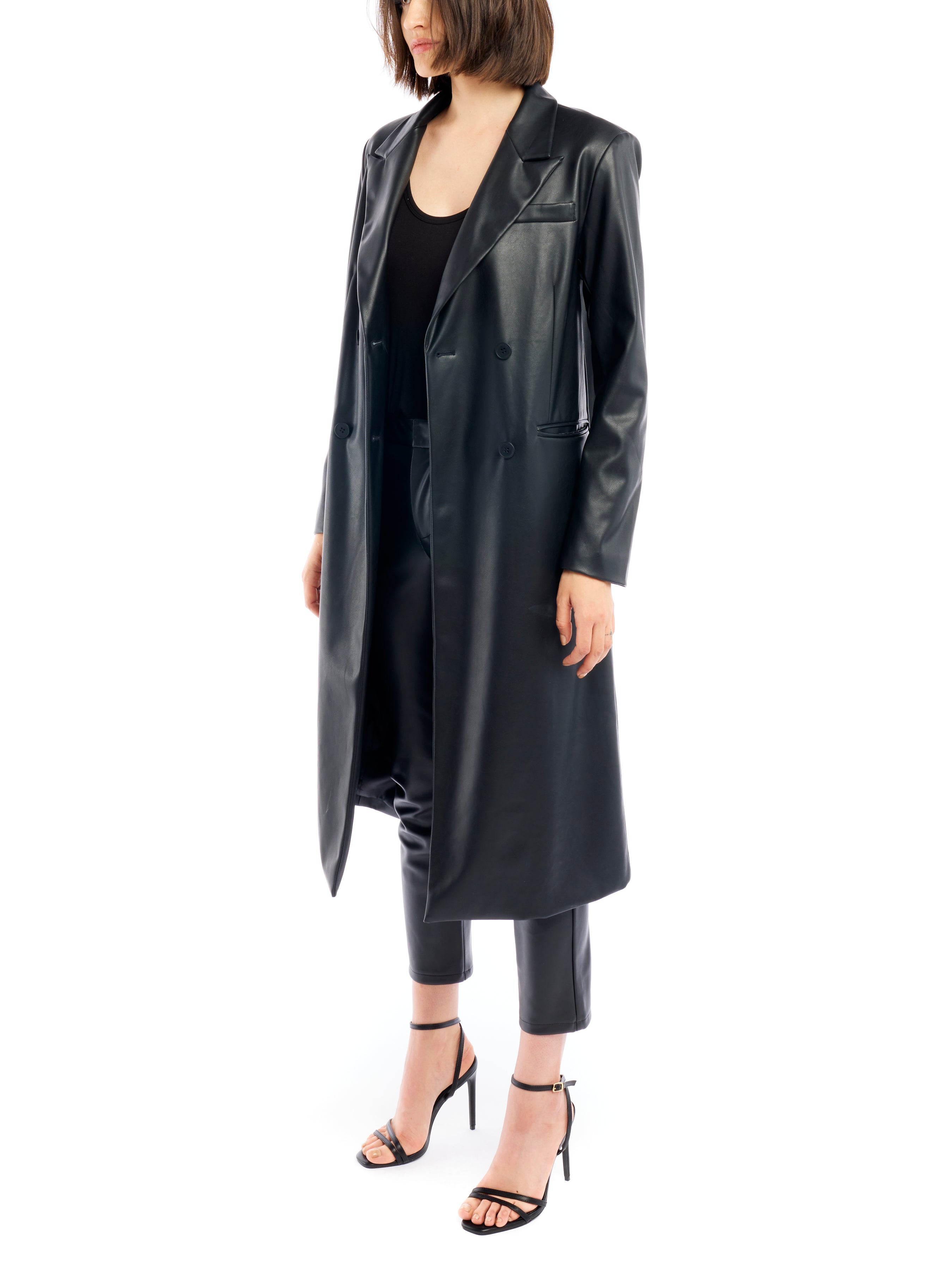 Midi length, double breasted, vegan leather jacket featuring long sleeves and pockets