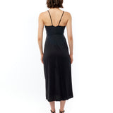 midi dress with a surplice top, gathered twist front, adjustable spaghetti straps and side slit in black