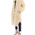 cozy jacket with shirt tail hem, midi length, two front pockets and long sleeves in cream