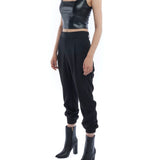 pleated pant with a tapered leg, elasticized cuffs, zip and button closure and side pockets in black