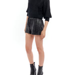 Black mid-rise shorts featuring an elasticized waist and easy, relaxed fit.