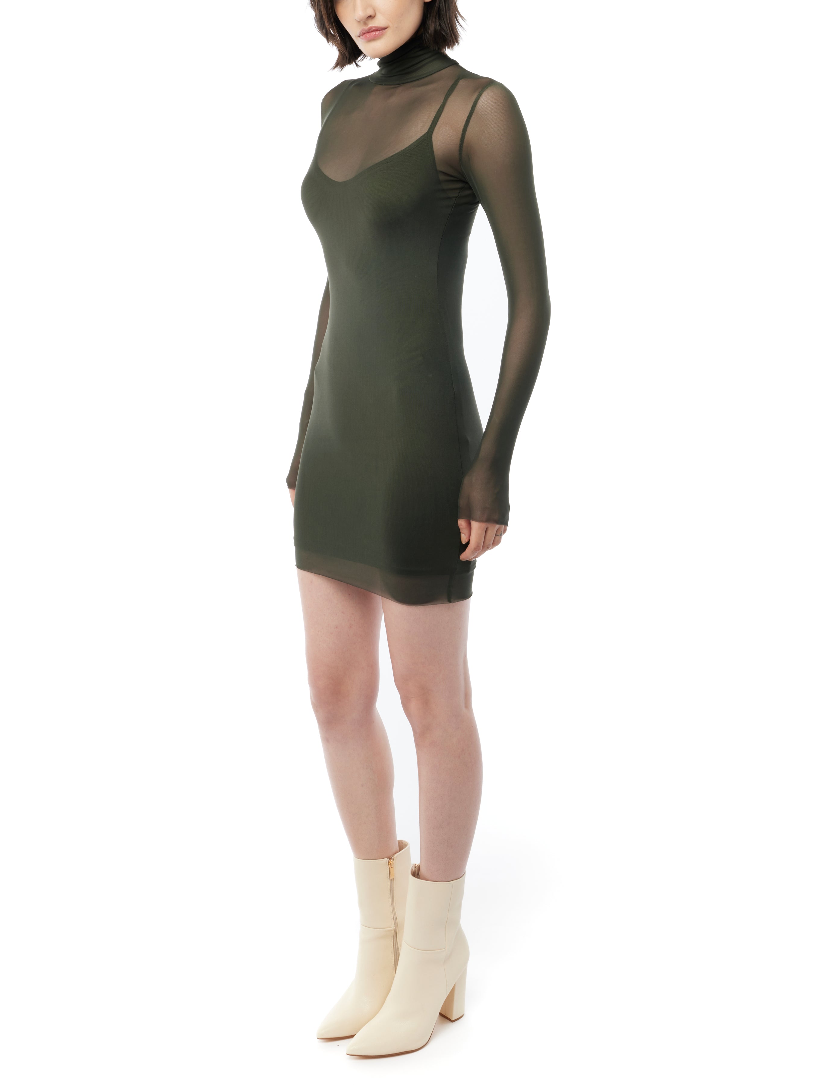 figure hugging, long sleeve mini dress with a sheer mock neck, sheer long sleeves with a spaghetti strap slip lining in olive