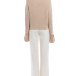 turtleneck sweater with a drop shoulder seam, large rolled cuffs, small side hem slits and a relaxed fit in oatmeal
