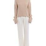 turtleneck sweater with a drop shoulder seam, large rolled cuffs, small side hem slits and a relaxed fit in oatmeal