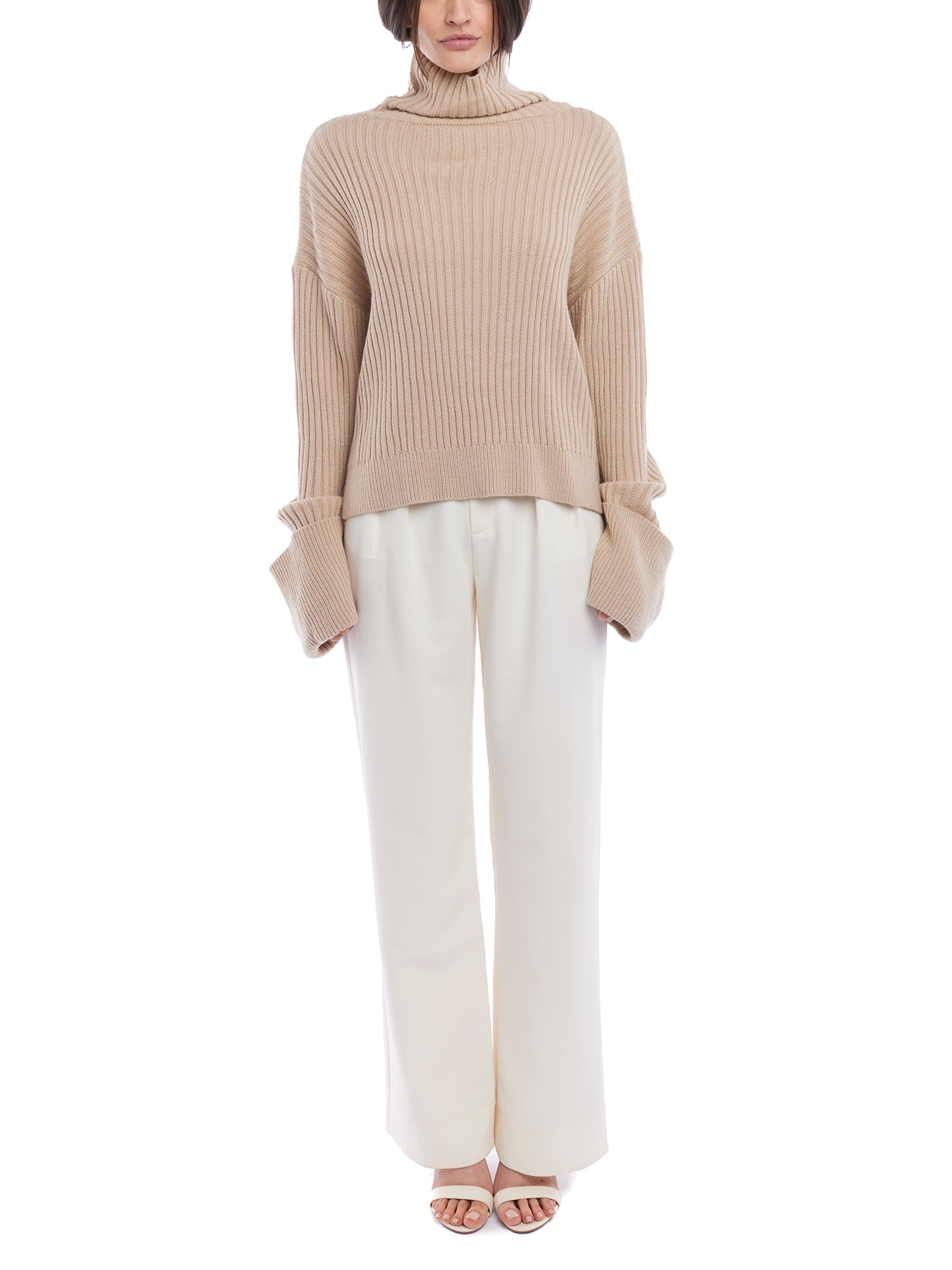 turtleneck sweater with a drop shoulder seam, large rolled cuffs, small side hem slits and a relaxed fit in oatmeal