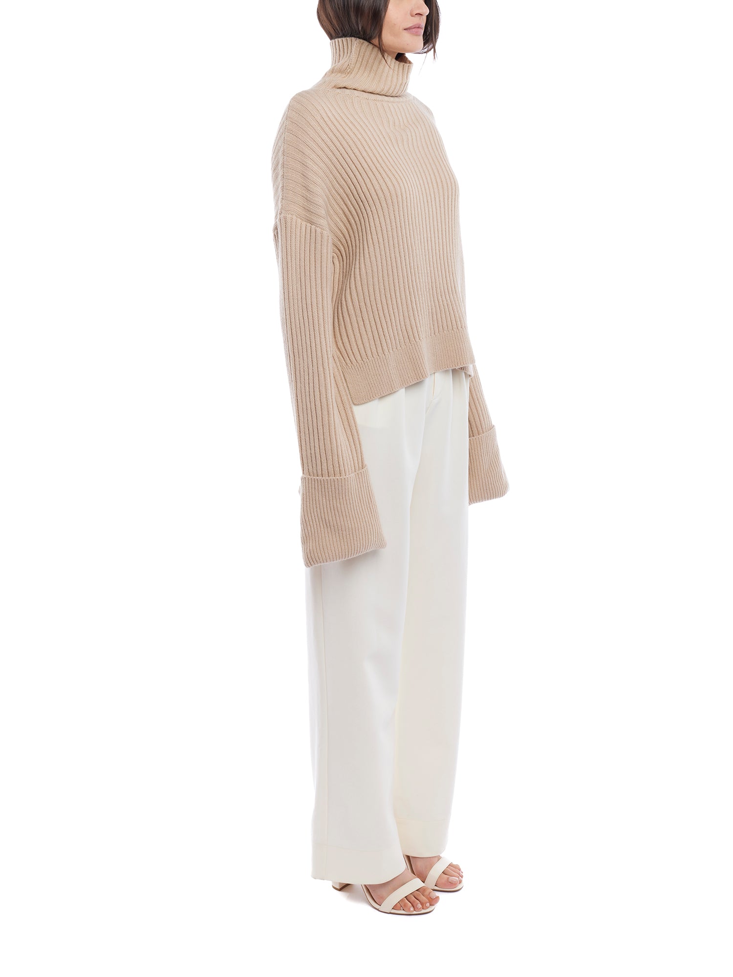 turtleneck sweater with a drop shoulder seam, large rolled cuffs, small side hem slits and a relaxed fit in oatmeal