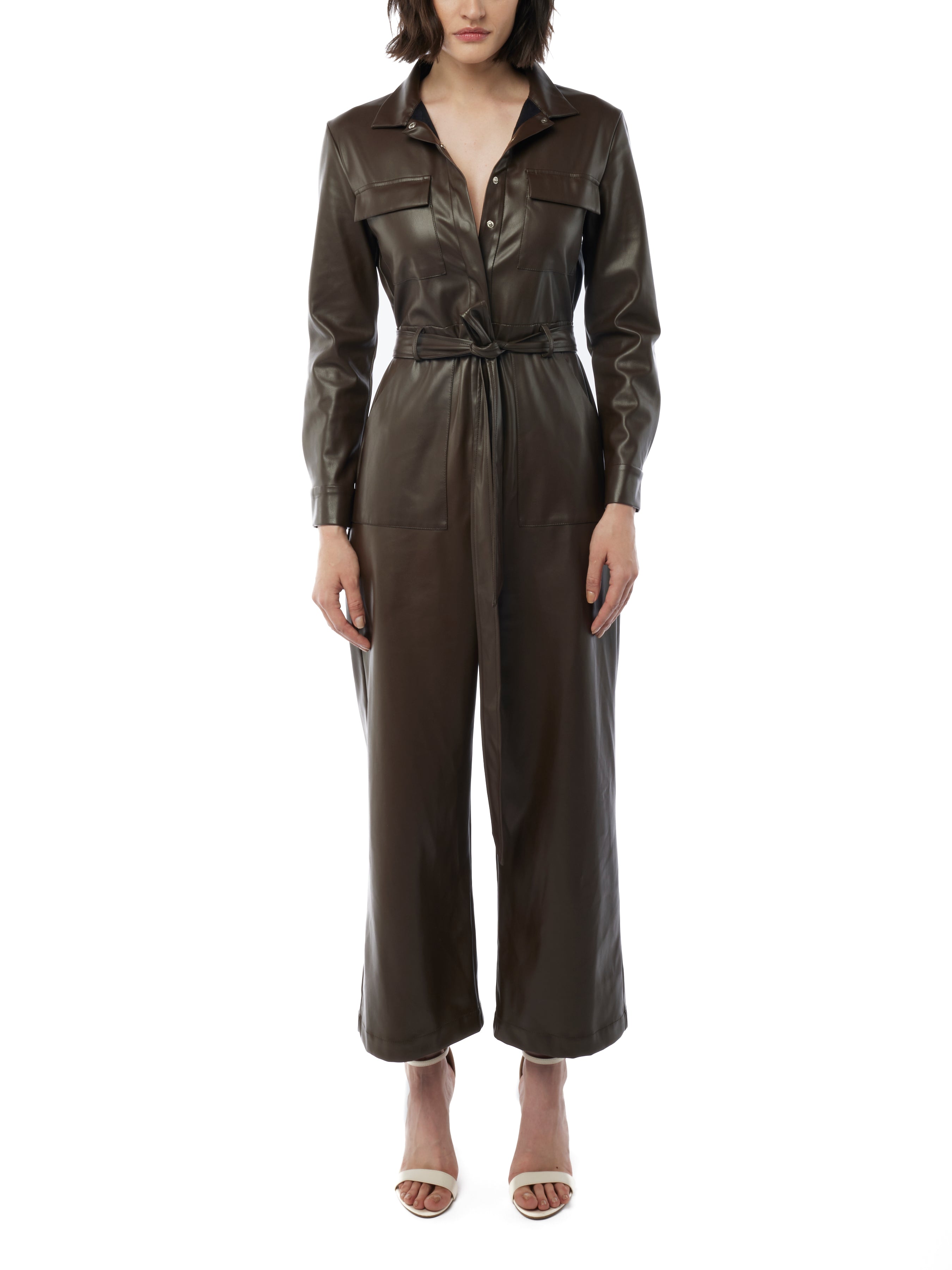 faux leather jumpsuit with long sleeves, wide legs, snap front, pockets and waist tie and elastic waist in maple