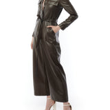 faux leather jumpsuit with long sleeves, wide legs, snap front, pockets and waist tie and elastic waist in maple