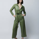faux leather jumpsuit with long sleeves, wide legs, hidden snap front, pockets and detachable waist tie and elastic waist