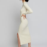 long sleeve, midi dress with a mock turtleneck, ribbed detailing, side slit and back cut out in ivory