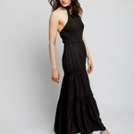 tiered maxi dress with mock neck, tie back halter, smocked bodice and back and ruffled detailing along the tiers in black