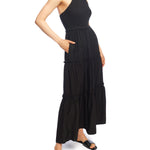 tiered maxi dress with mock neck, tie back halter, smocked bodice and back and ruffled detailing along the tiers in black