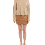 mock sweater features long sleeves and slightly cropped length in sand