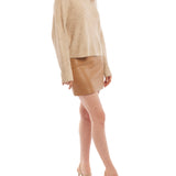 mock sweater features long sleeves and slightly cropped length in sand