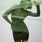 figure hugging, long sleeve mini dress with a sheer mock neck, sheer long sleeves with a spaghetti strap slip lining in olive