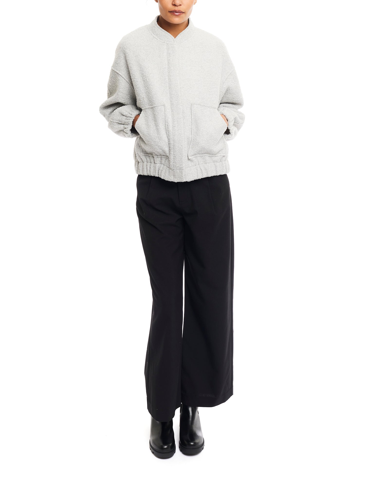 cozy, zip up jacket with elasticized cuffs and bottom hem, front pockets and a varsity collar