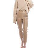 cropped faux leather pant with a mid rise, zipper and button closure and side and back pockets in taupe
