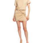 short sleeve dress with a crew neck, elasticized, blouson waist, mini length and a twisted front panel over the skirt