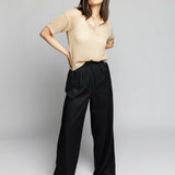 breezy open knit, short sleeve, collared top with a chic notch-neck and ribbed detailing on hem, sleeves and collar