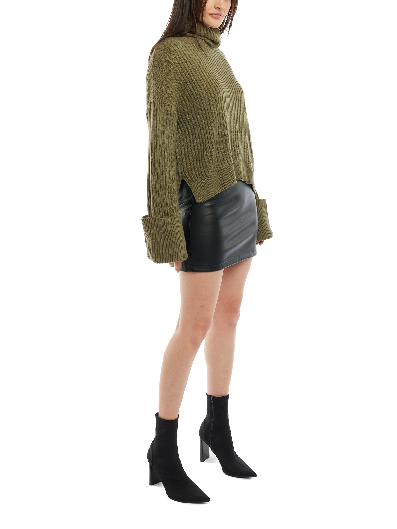 turtleneck sweater with a drop shoulder seam, large rolled cuffs, small side hem slits and a relaxed fit in olive