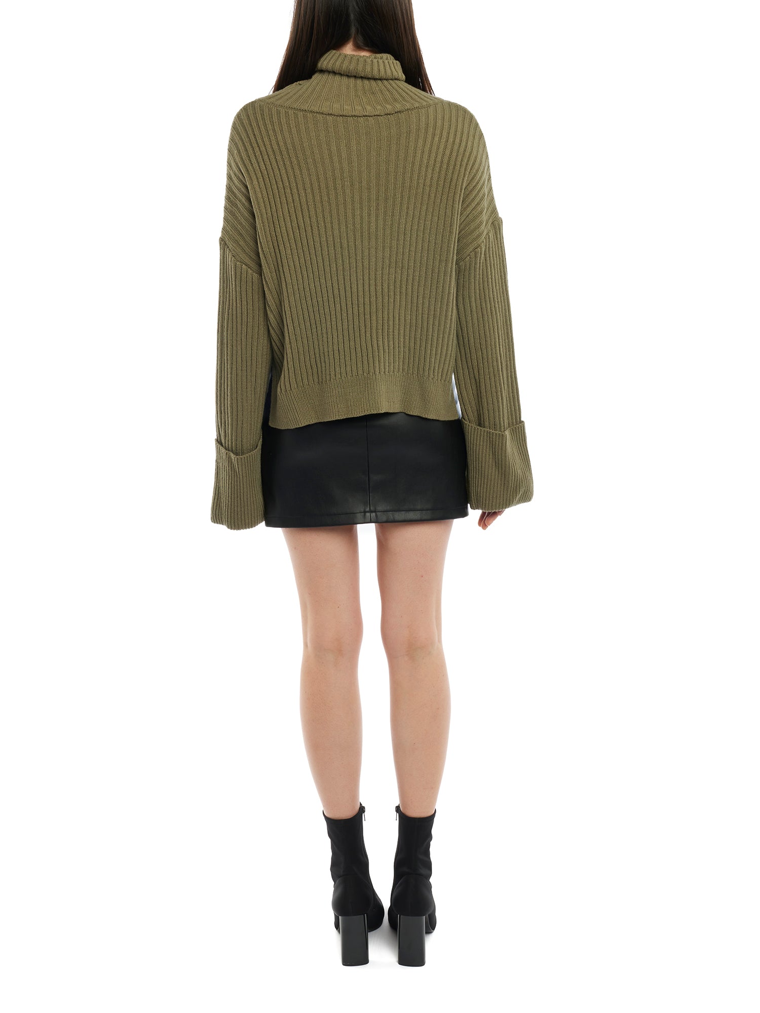 turtleneck sweater with a drop shoulder seam, large rolled cuffs, small side hem slits and a relaxed fit in olive