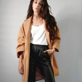 Cari oversized coat with an open front, pointed collar, large cuffs and side slits in camel