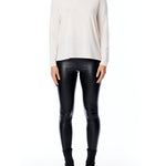 turtleneck sweater with long sleeves, relaxed fit, cross seam detailing and drop shoulder in cream